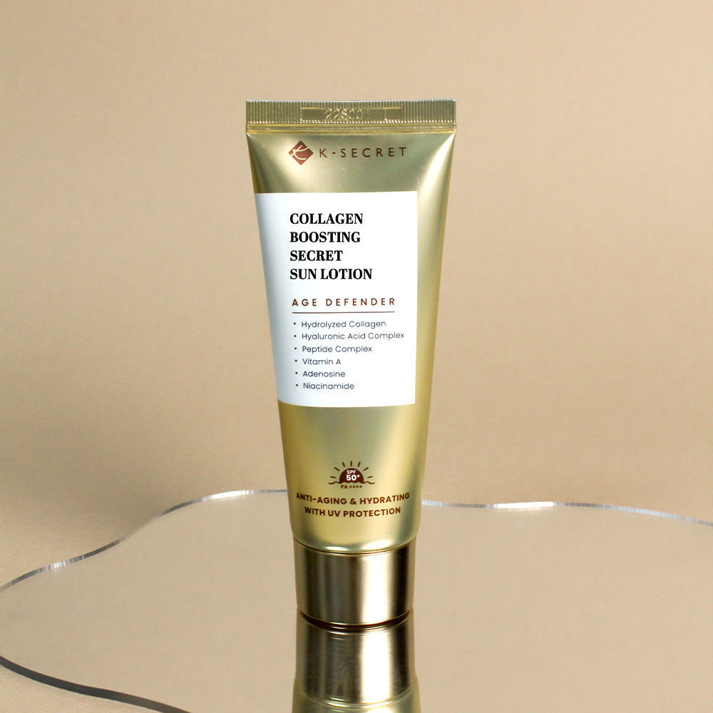 Gold tube of KSECRET COLLAGEN BOOSTING SECRET SUN LOTION for skin hydration and protection.